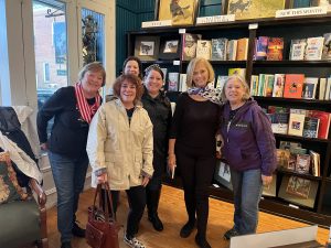 Picture of five women visiting Diana McDonough at the Greyhound Bookstore.